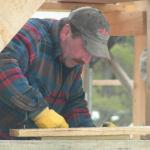 under the peak,  Darryl Osborne levels concrete into the window openings